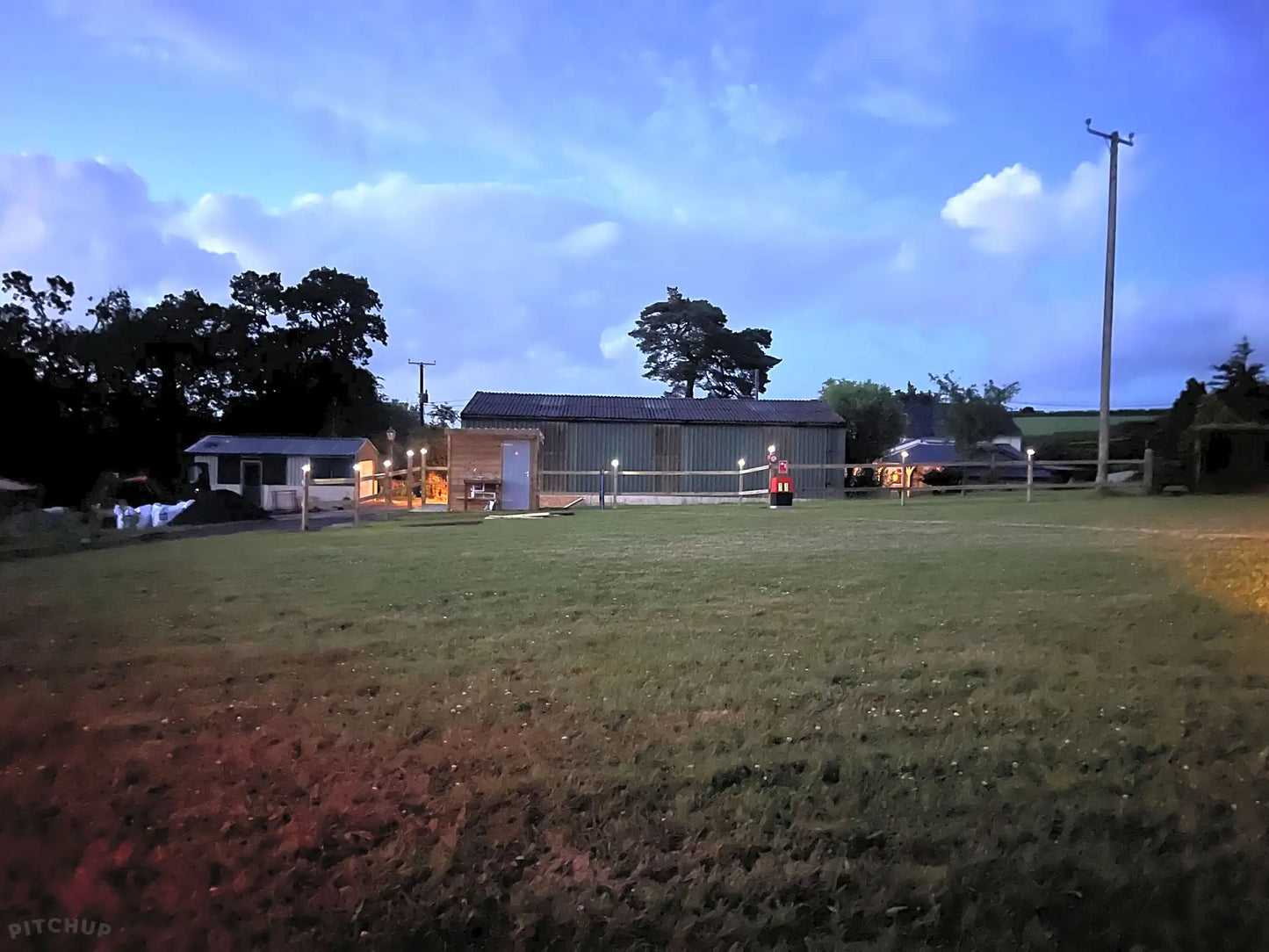Electric optional grass and gravel touring pitch